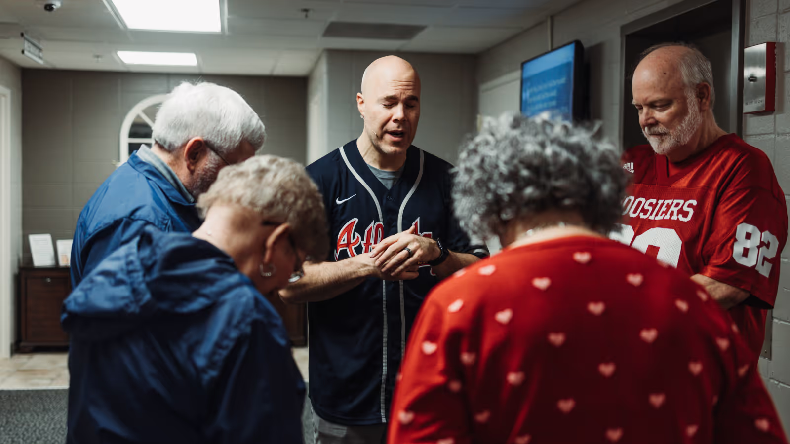 Senior adults greeting one another