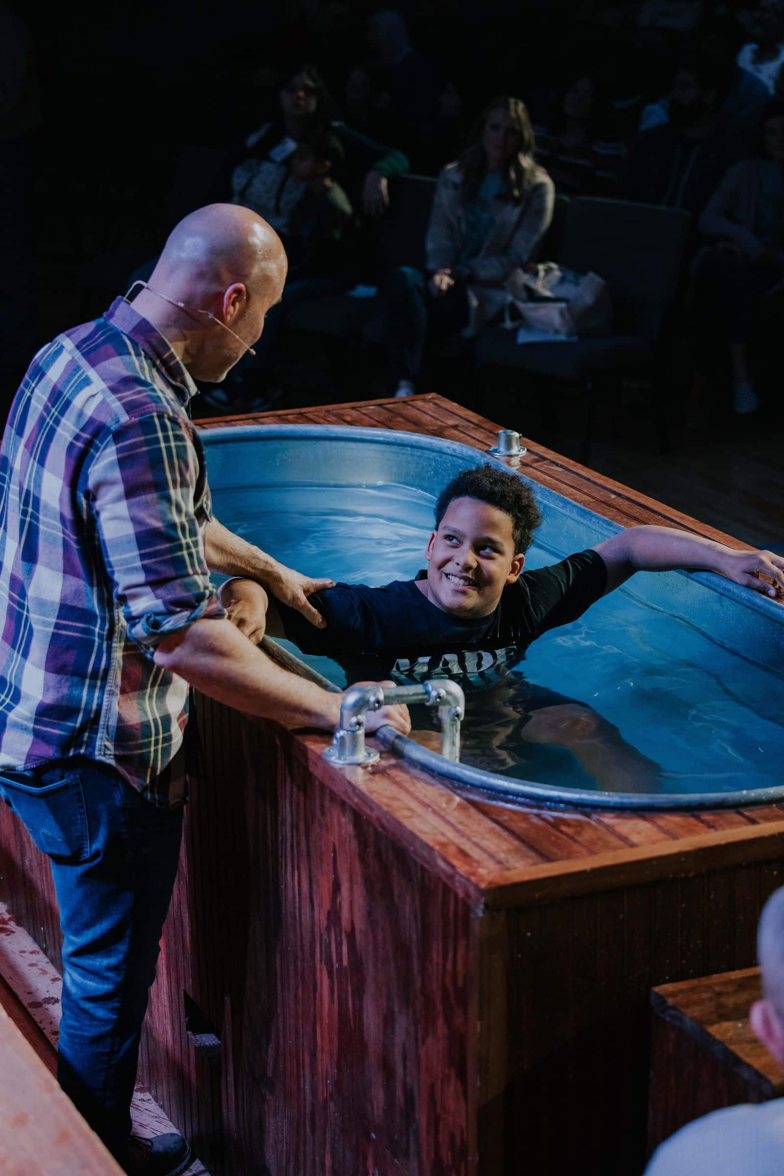 Young man being baptized