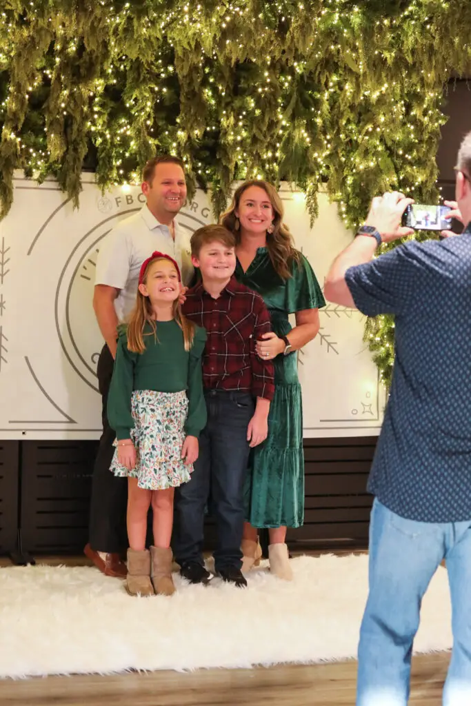 A family taking a Christmas photo at FBCPS